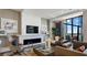 Elegant living room featuring a fireplace, a large window, and sleek, modern furniture at 100 1St N Ave # 1005, St Petersburg, FL 33701