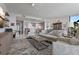 Open-concept living room featuring modern furnishings, bright tile flooring, and view of the kitchen at 100 1St N Ave # 1005, St Petersburg, FL 33701