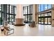 Modern building lobby featuring a grand column, expansive windows, and elegant seating area at 100 1St N Ave # 1005, St Petersburg, FL 33701