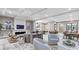 Comfortable and inviting lounge area with a fireplace, TV, modern furniture, and stylish decor at 100 1St N Ave # 1005, St Petersburg, FL 33701