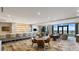 Spacious lounge area featuring a bar, comfortable seating, and stunning waterfront views at 100 1St N Ave # 1005, St Petersburg, FL 33701