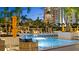 Gorgeous outdoor pool with plenty of chairs and umbrellas, creating a luxurious retreat at 100 1St N Ave # 1005, St Petersburg, FL 33701
