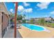 Gorgeous in-ground pool is surrounded by tropical landscaping, offering a private backyard oasis at 1012 Spindle Palm Way, Apollo Beach, FL 33572