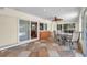 The sunroom features tile floors, a ceiling fan, and a bar area with seating at 1012 Spindle Palm Way, Apollo Beach, FL 33572