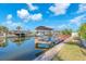 Waterfront property with boat dock and canal access for easy boating and recreation at 1012 Spindle Palm Way, Apollo Beach, FL 33572
