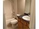A bathroom featuring a tub, toilet, sink, and vanity at 10316 Carrollwood Ct # 57, Tampa, FL 33618