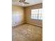 A bedroom with neutral walls, carpeted floors, a ceiling fan, and a window at 10316 Carrollwood Ct # 57, Tampa, FL 33618
