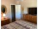 A bedroom with neutral walls, carpeted floors, and a full set of furniture at 10316 Carrollwood Ct # 57, Tampa, FL 33618
