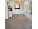 The dining area flows into the kitchen and is illuminated by a decorative light fixture at 10316 Carrollwood Ct # 57, Tampa, FL 33618
