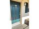 Close-up of a front door with classic design and charming details and a matching shuttered window at 10316 Carrollwood Ct # 57, Tampa, FL 33618