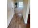 Inviting foyer with tile floors transitions to the expansive carpeted living area with a view to the exterior at 10316 Carrollwood Ct # 57, Tampa, FL 33618