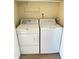 A laundry room area featuring a white washing machine and a white dryer at 10316 Carrollwood Ct # 57, Tampa, FL 33618