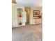 Bright living room features a built-in bookcase, neutral carpet, and traditional-style furniture at 10316 Carrollwood Ct # 57, Tampa, FL 33618