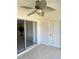 Tiled patio featuring a ceiling fan and a sliding glass door leading into the living area at 10316 Carrollwood Ct # 57, Tampa, FL 33618