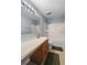 Bathroom featuring a bathtub with shower, toilet, and single sink with brown wood cabinet at 10849 Kensington Park Ave, Riverview, FL 33578