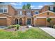 Charming townhome featuring an attached garage, manicured lawn, and lovely front entry at 10849 Kensington Park Ave, Riverview, FL 33578