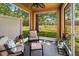 Relaxing screened patio with comfortable seating, providing a peaceful outdoor living space at 10849 Kensington Park Ave, Riverview, FL 33578