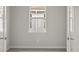 Empty room with two doors and one window allowing for plenty of natural light to enter at 11290 Boundless Ter, Venice, FL 34293