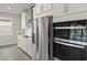 Modern kitchen featuring stainless steel appliances, sleek countertops, and contemporary cabinetry at 11290 Boundless Ter, Venice, FL 34293