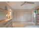 Spacious bedroom featuring a large closet, neutral colors, and a ceiling fan at 11728 Carissa Ln # 0, New Port Richey, FL 34654