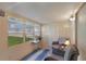 Cozy sunroom featuring a comfortable seating area and a large window with a green view at 11728 Carissa Ln # 0, New Port Richey, FL 34654