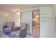 Relaxing sunroom featuring cozy seating, string lights, and access to the bedroom at 11728 Carissa Ln # 0, New Port Richey, FL 34654