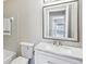 Bathroom featuring tub, toilet, vanity, sink, mirror, and neutral walls at 1203 16Th Se Cir, Largo, FL 33771
