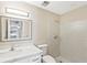 Bathroom featuring tiled walk-in shower, modern vanity with sink and mirror, and neutral walls at 1203 16Th Se Cir, Largo, FL 33771