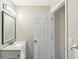 The bathroom has a modern vanity, stylish mirror, and neutral wall colors at 1203 16Th Se Cir, Largo, FL 33771