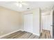 Bedroom features include wood-look floors, a ceiling fan, and a closet at 1203 16Th Se Cir, Largo, FL 33771