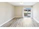 Unfurnished bedroom with neutral walls, base molding, and sliding glass doors to the exterior at 1203 16Th Se Cir, Largo, FL 33771
