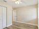 This bedroom has light, bright walls, stylish wood floors, and a ceiling fan for comfort at 1203 16Th Se Cir, Largo, FL 33771