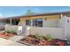 Exterior view featuring the home entrance, landscaping, and slider to the porch at 1203 16Th Se Cir, Largo, FL 33771