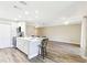 Spacious kitchen with stainless steel appliances, a breakfast bar, and a view of the living area at 1203 16Th Se Cir, Largo, FL 33771