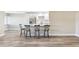Modern kitchen featuring a central island with breakfast bar seating and stainless steel appliances at 1203 16Th Se Cir, Largo, FL 33771