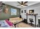 Comfortable bedroom with a desk and ample natural light at 129 Nw Lincoln N Cir, St Petersburg, FL 33702