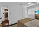 Bedroom with a ceiling fan, a television, a closet, and a comfortable bed with a knit blanket at 129 Nw Lincoln N Cir, St Petersburg, FL 33702