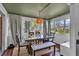 Cozy dining room with a large window and seating for six at 129 Nw Lincoln N Cir, St Petersburg, FL 33702