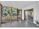 Enclosed porch featuring an ample view of the fenced in backyard at 129 Nw Lincoln N Cir, St Petersburg, FL 33702