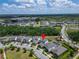 An aerial view shows the home's location in a beautiful neighborhood with mature trees at 13042 Pennybrook Dr, Riverview, FL 33579