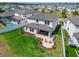 Beautifully landscaped backyard featuring a covered patio, outdoor seating, and lush green lawn at 13042 Pennybrook Dr, Riverview, FL 33579