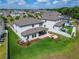 Overhead view of the backyard featuring a covered patio, outdoor seating, and manicured lawn at 13042 Pennybrook Dr, Riverview, FL 33579