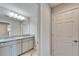 Bright bathroom with double granite vanity and large mirrors at 13042 Pennybrook Dr, Riverview, FL 33579