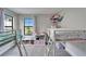 bedroom with grey carpet, two windows, and lofted beds with storage at 13042 Pennybrook Dr, Riverview, FL 33579