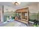Cozy bedroom featuring a wooden playhouse bed, mountain wall mural, and whimsical decor at 13042 Pennybrook Dr, Riverview, FL 33579