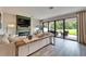 Cozy living room with a fireplace and sliding glass doors to an outdoor patio at 13042 Pennybrook Dr, Riverview, FL 33579