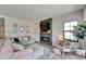 Comfortable living room featuring a modern fireplace and plenty of natural light at 13042 Pennybrook Dr, Riverview, FL 33579