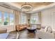 Cozy lounge area showcases a leather sofa and modern decor at 13042 Pennybrook Dr, Riverview, FL 33579