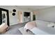 Bright main bedroom with gray carpet, mounted television, and entry to bathroom and walk-in closet at 13042 Pennybrook Dr, Riverview, FL 33579