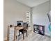 A well-lit office features a rustic desk, comfortable chair, and organized storage solutions at 13042 Pennybrook Dr, Riverview, FL 33579